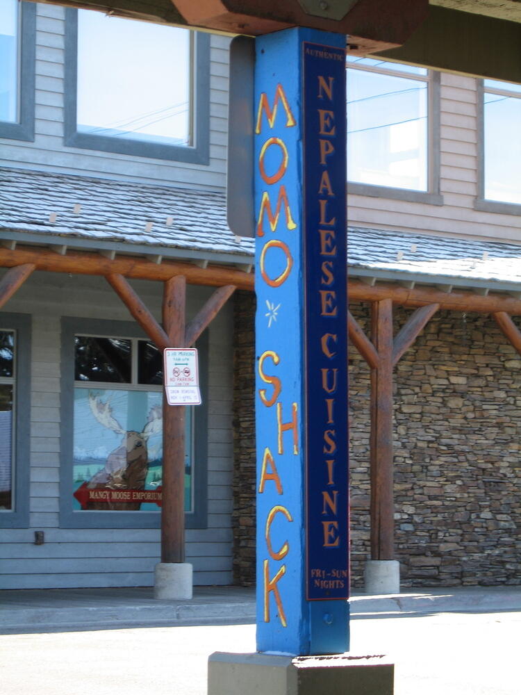 D.O.G. does not, in fact, serve momos or Nepalese cuisine.