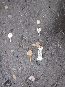 Keys at the base of art bollard