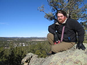 Ben climbed a rock.
